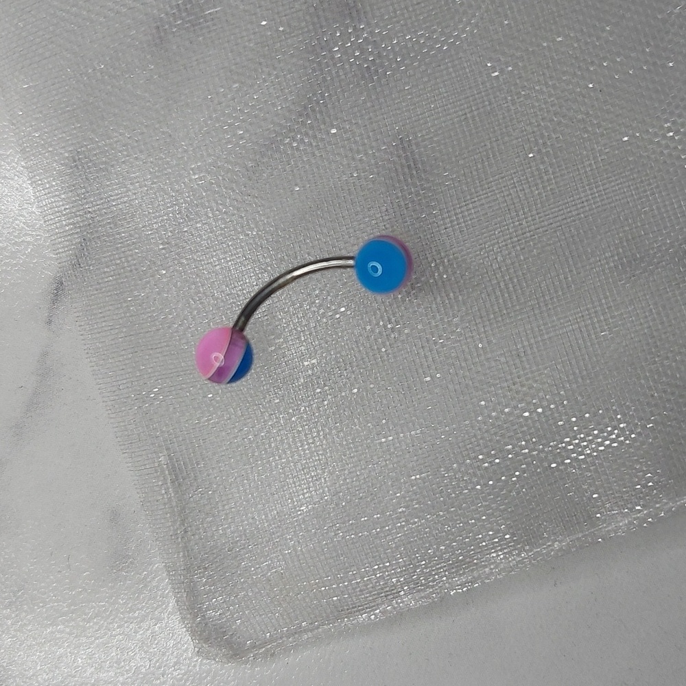 3/4" curved barbell with pink,blue, and purple striped balls